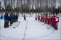 The teams line up at center ice.